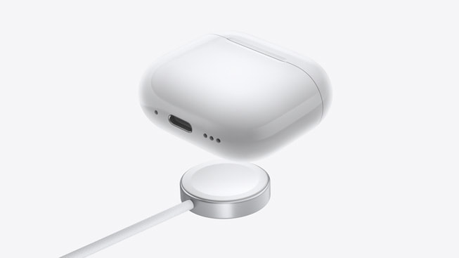Apple AirPods 4 with Active Noise Cancellation wireless charging case with Apple Watch charger — official Apple image