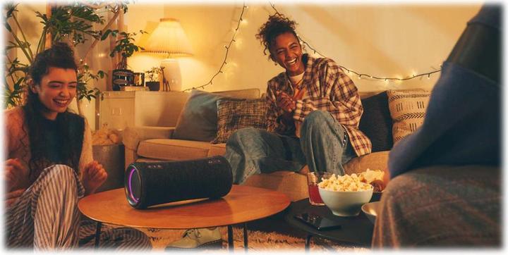 Sony SRS-XG300 Black — Black speaker on a table in a listening scene