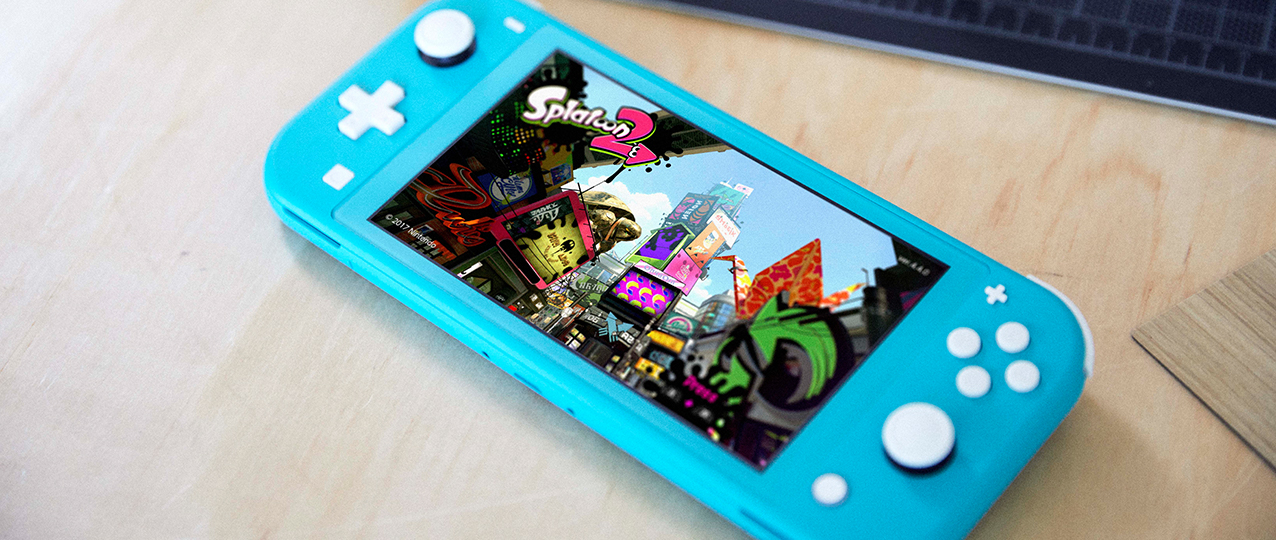 Nintendo Switch Lite Turquoise resting on a surface during handheld gameplay