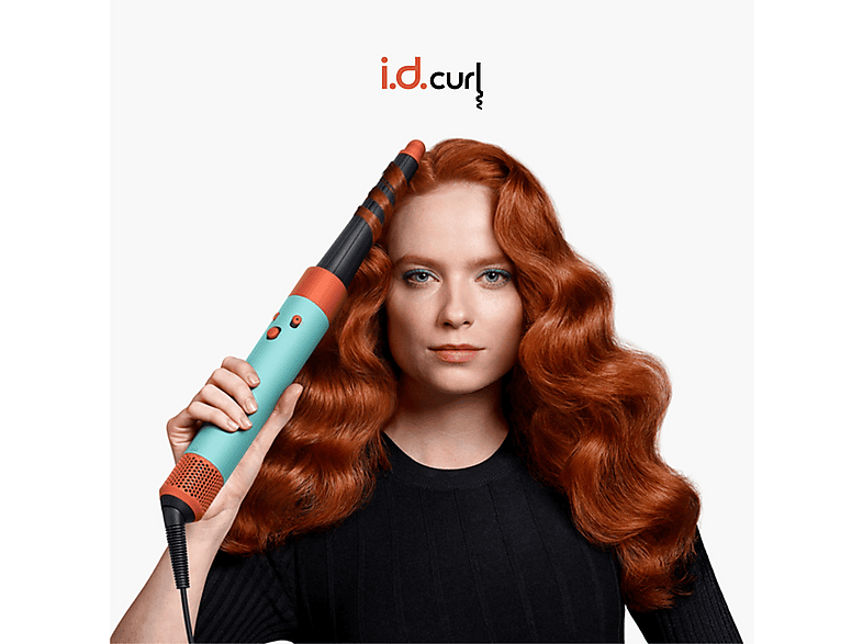 Dyson Airwrap i.d. Ceramic Patina/Topaz and defined curls, front lifestyle view