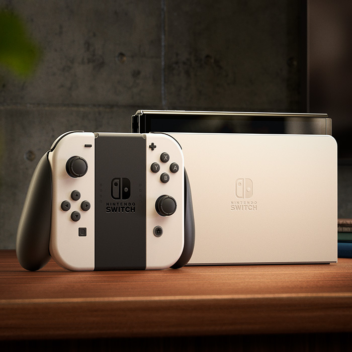 Nintendo Switch OLED White set with console and dock on a wooden surface