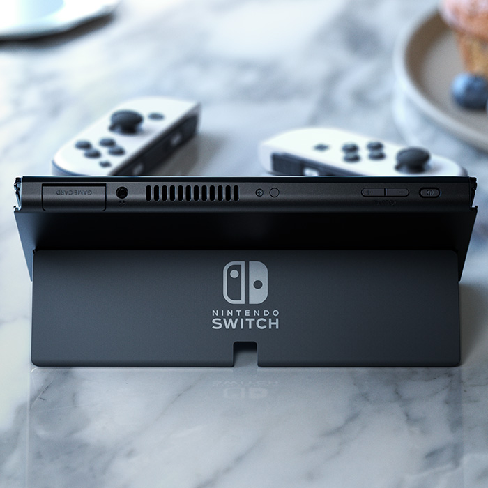 Nintendo Switch OLED console rear and top ports with white Joy-Con behind it