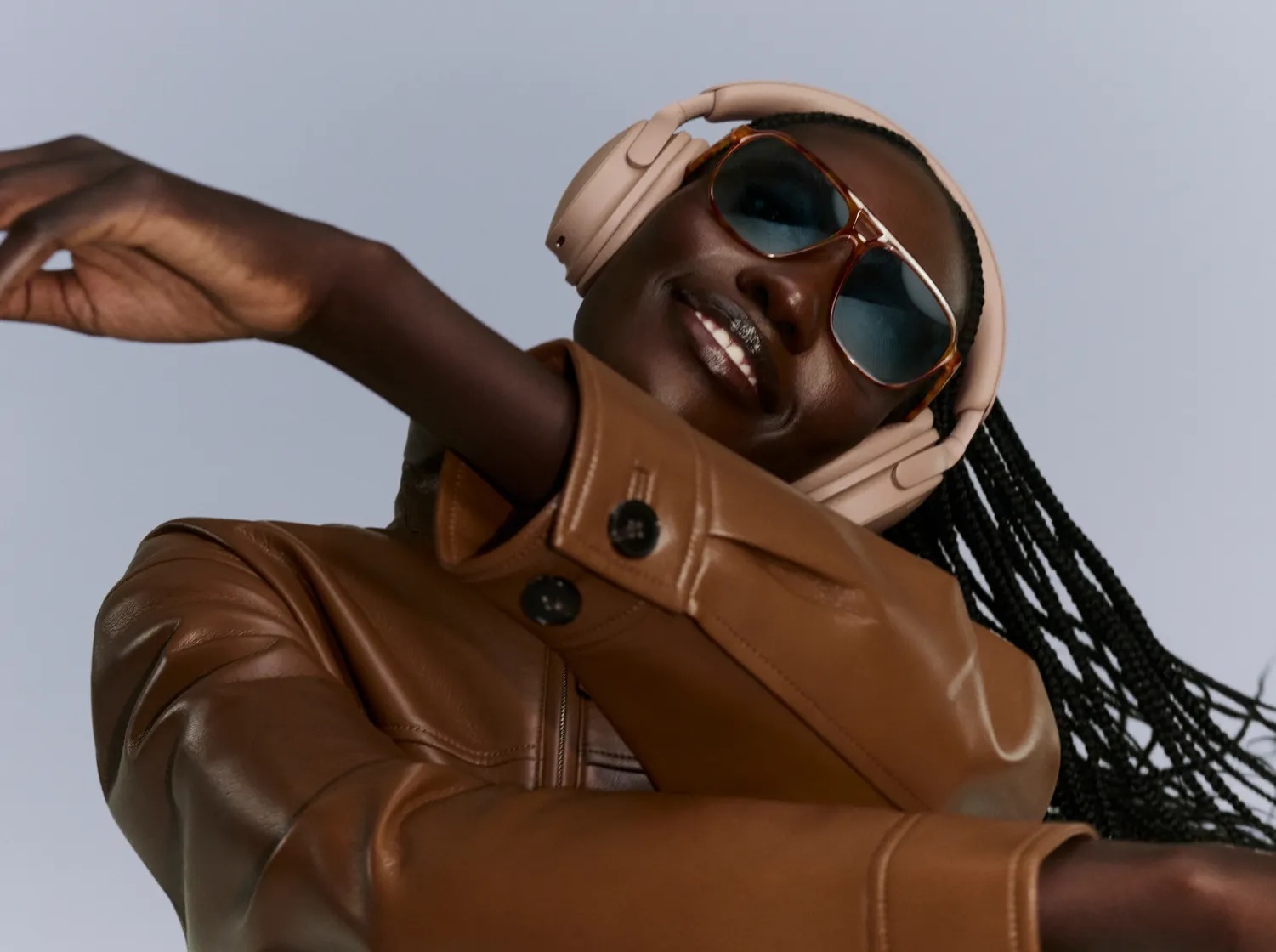 Bose QuietComfort Headphones (2nd Gen) in Hazelnut Taupe — lifestyle view worn by a model