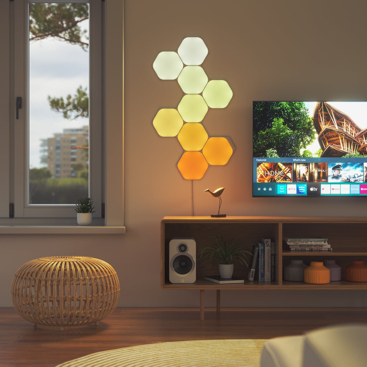 Nanoleaf Shapes White Hexagons nine-panel layout beside a television