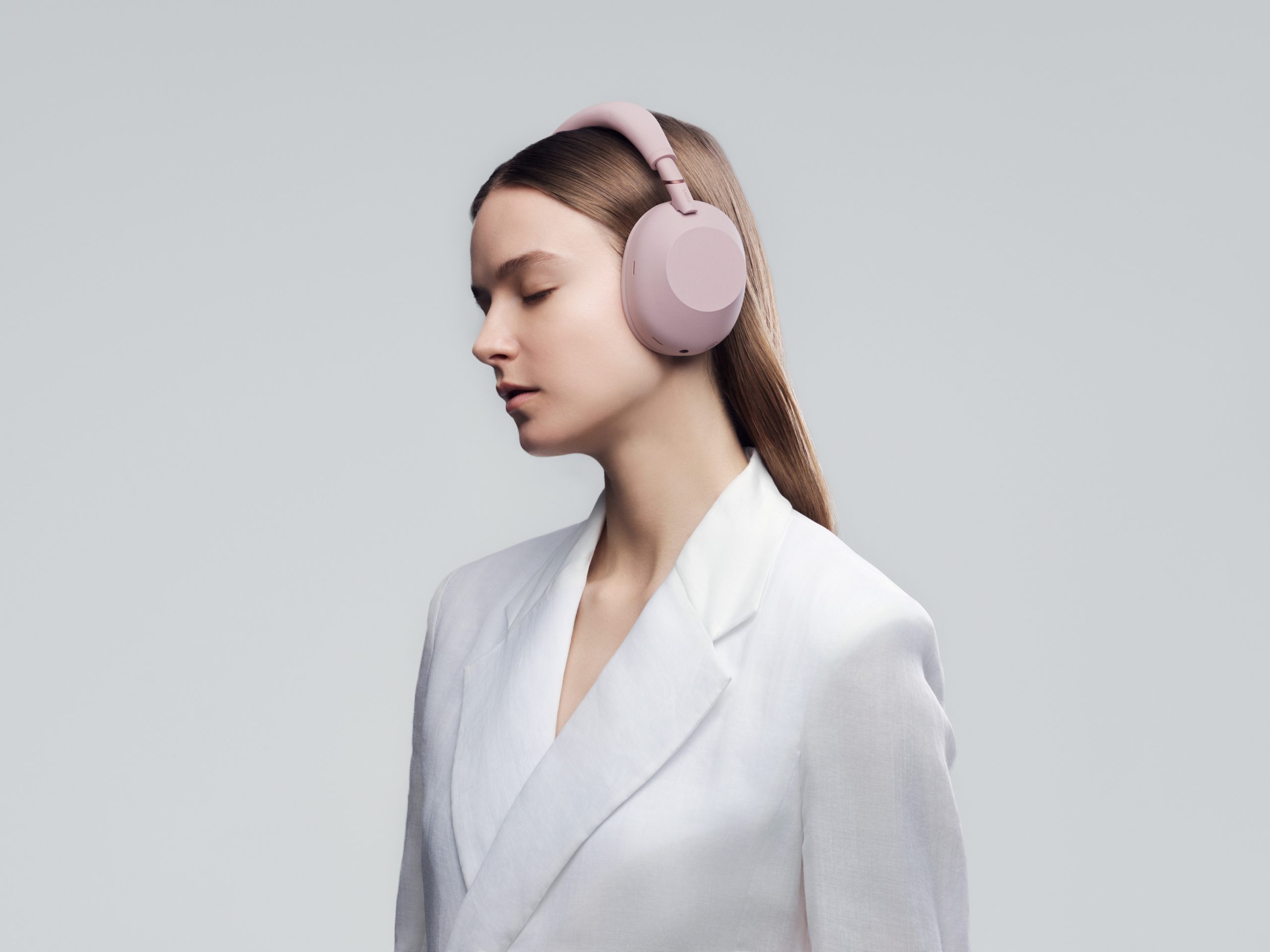 Sony WH-1000XM6 Wireless Noise Cancelling Headphones (Sand Pink) — Sand Pink headphones worn in profile